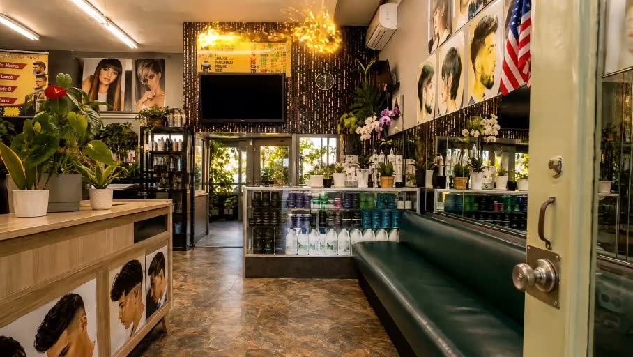 Inside Irma's Beauty Salon: plants along the counter, product shelves, a long green banquette and mirrors down the wall.
